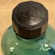 Small vintage dark turquoise blue bottle
