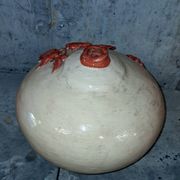 Large vase with relief plant decoration, raw art.