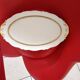 Oval dish. Limoges Montambert art porcelain. White matt gold rim;