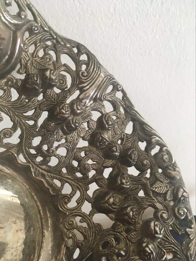 Silver metal basket with floral decoration