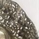 Silver metal basket with floral decoration
