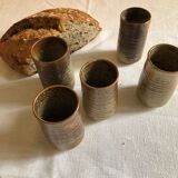 Series of five cups in sandstone