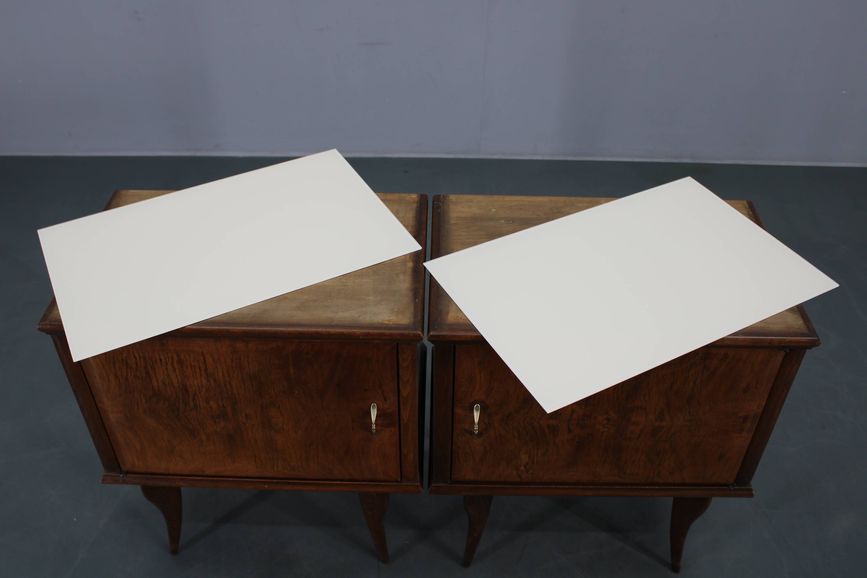 Pair of mid-century Italian walnut nightstands with glass top, 1950s