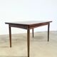 Rosewood dining table with integrated extensions — Denmark, 1960s
