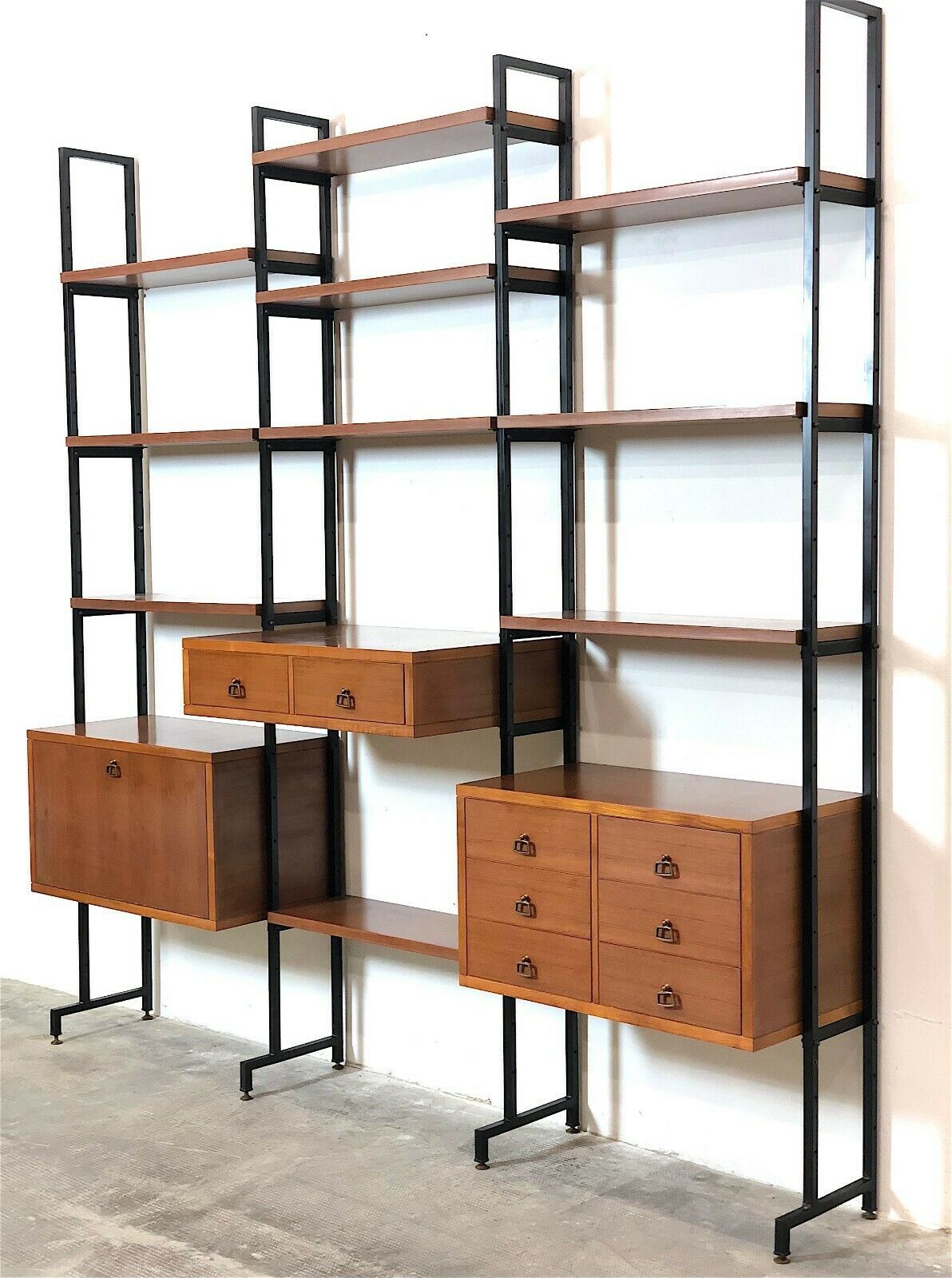 Modular storage unit and teak bookcase. Italy, 60s