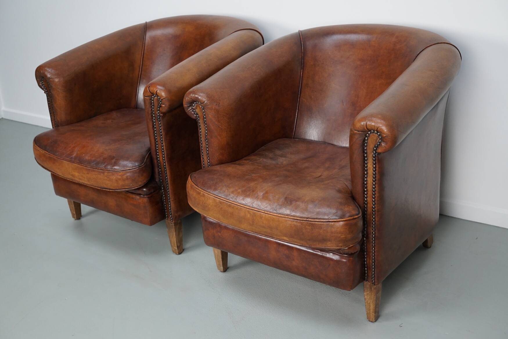 Vintage Dutch cognac coloured leather club chair, set of 2 with footstool