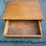 High bedside table in solid wood with drawers on casters
