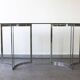 Smoked glass console with chrome legs, 1970.