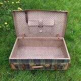 Old large suitcase in leather and tartan fabric