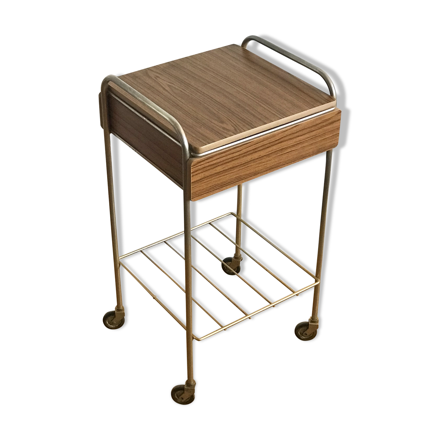 Serving bedside in gold metal and formica