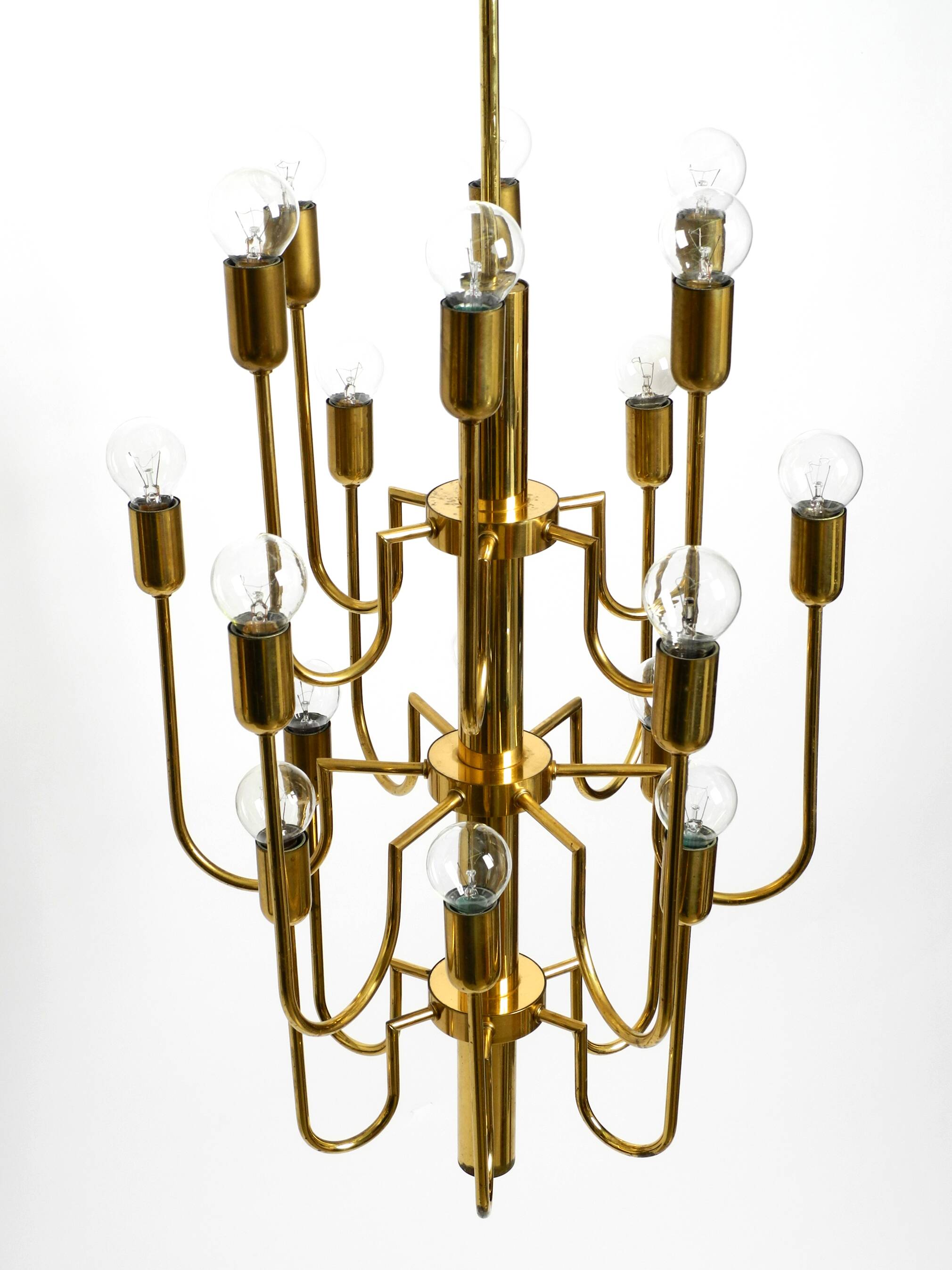Three staged 18 arm Mid Century brass chandelier with a long brass rod