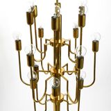 Three staged 18 arm Mid Century brass chandelier with a long brass rod