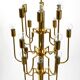 Three staged 18 arm Mid Century brass chandelier with a long brass rod