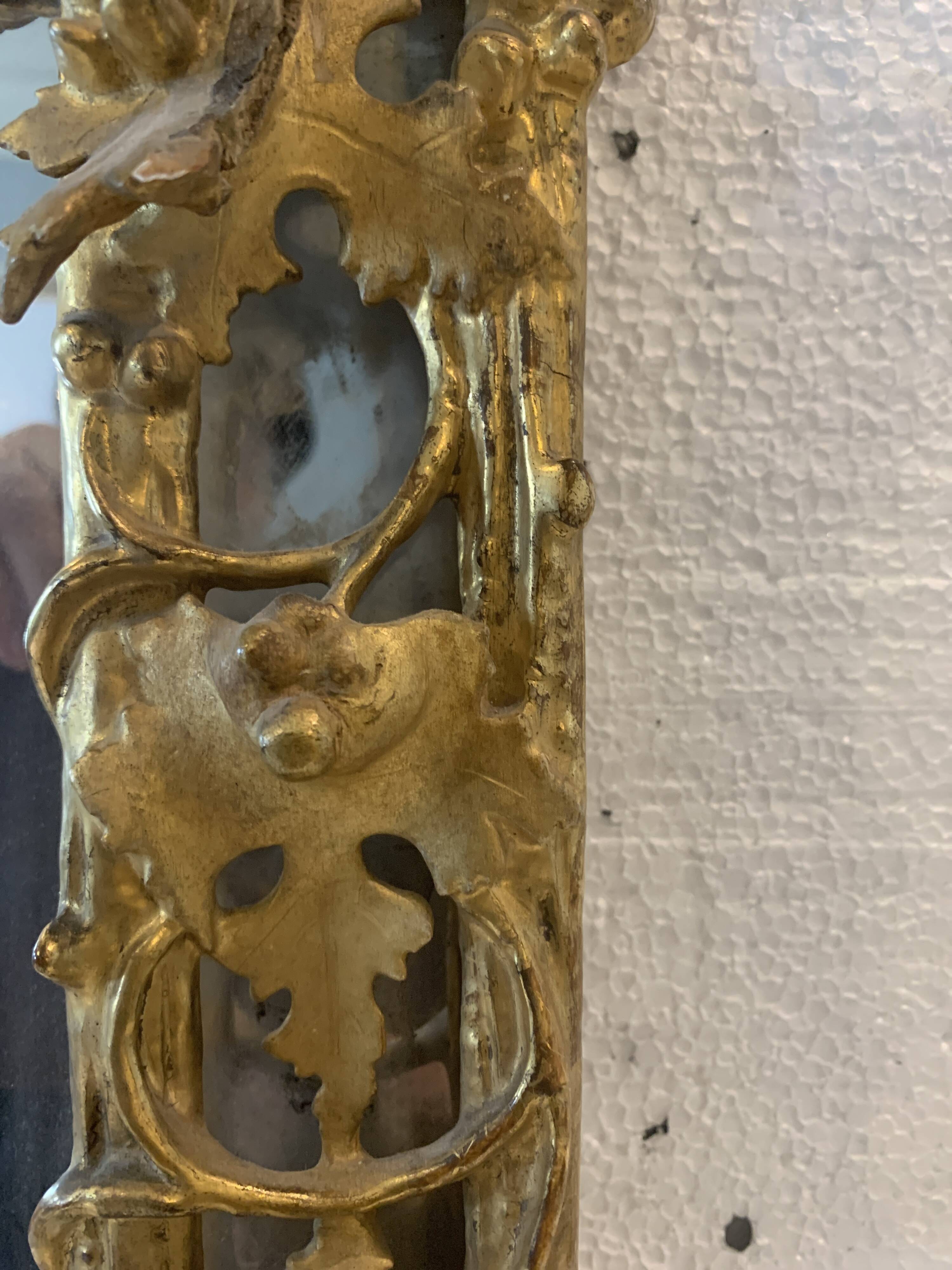 Louis XVI style mirror in carved wood and gilded with gold leaf, 19th century