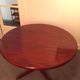 Round rosewood table with central leg, Scandinavian design møllers møbelfabrik