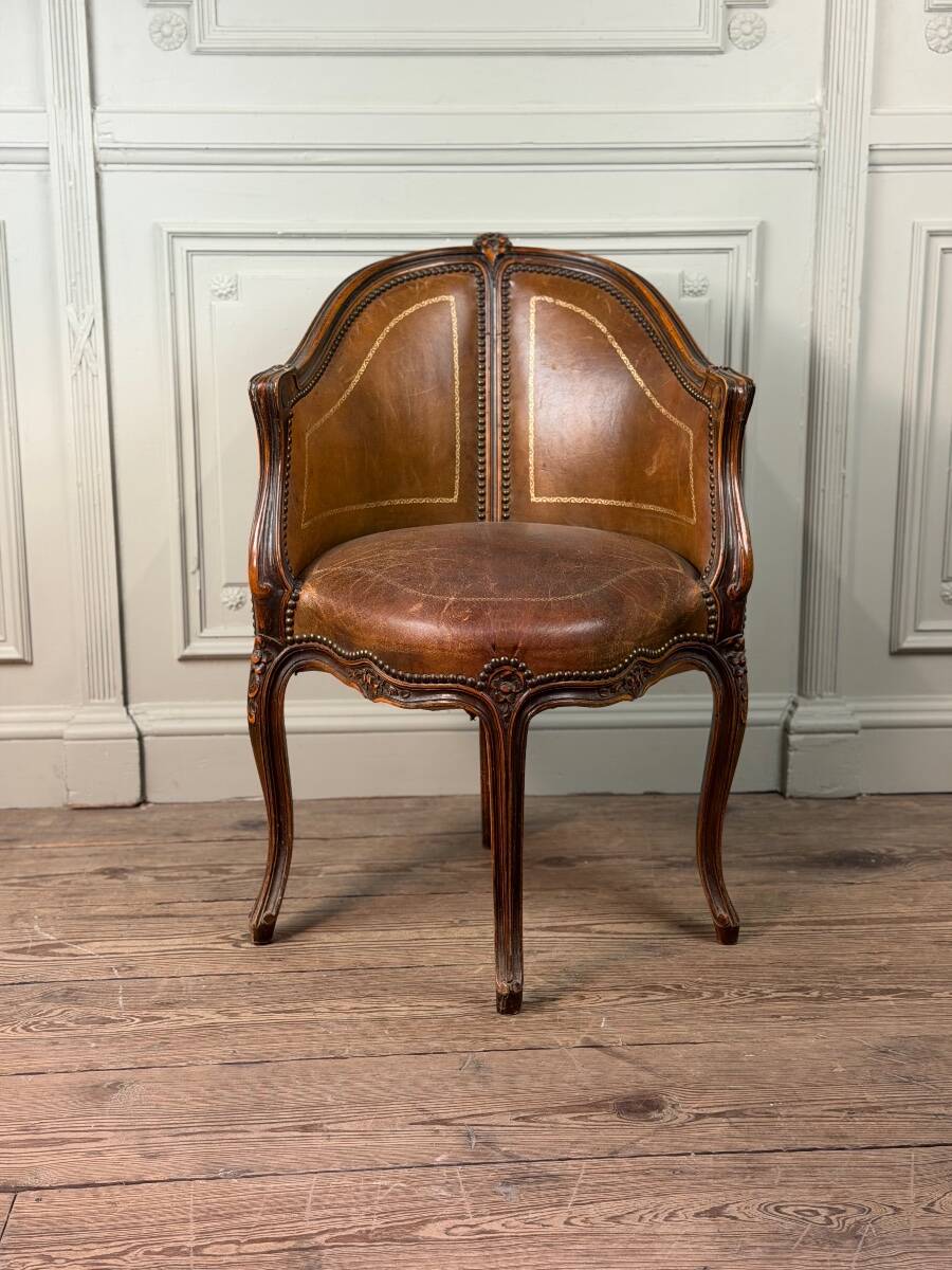 Louis XV style office chair in carved wood, brown leather, circa 1920.