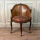 Louis XV style office chair in carved wood, brown leather, circa 1920.