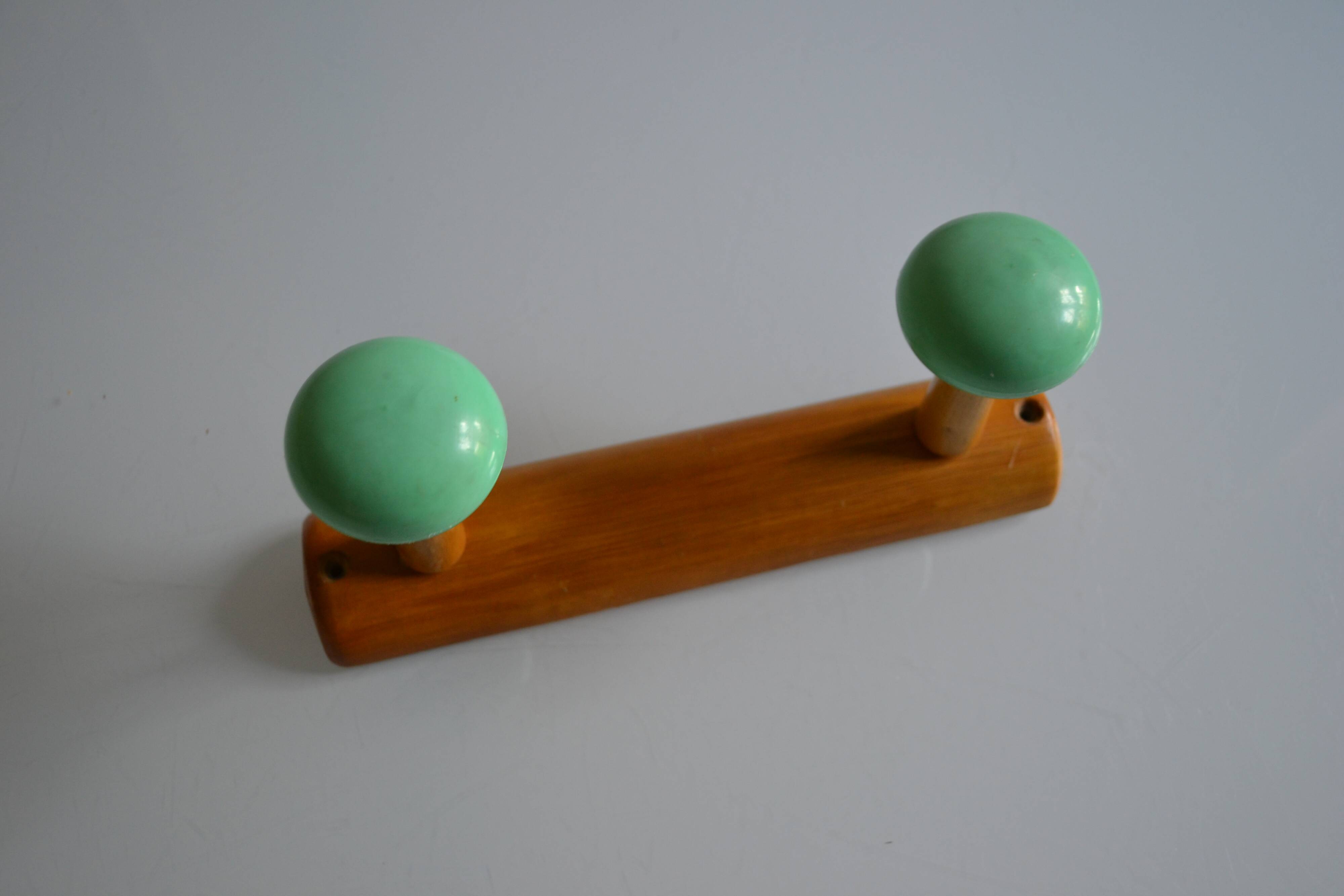 Wall coat rack with 2 hooks, wood and plastic, 60s style.