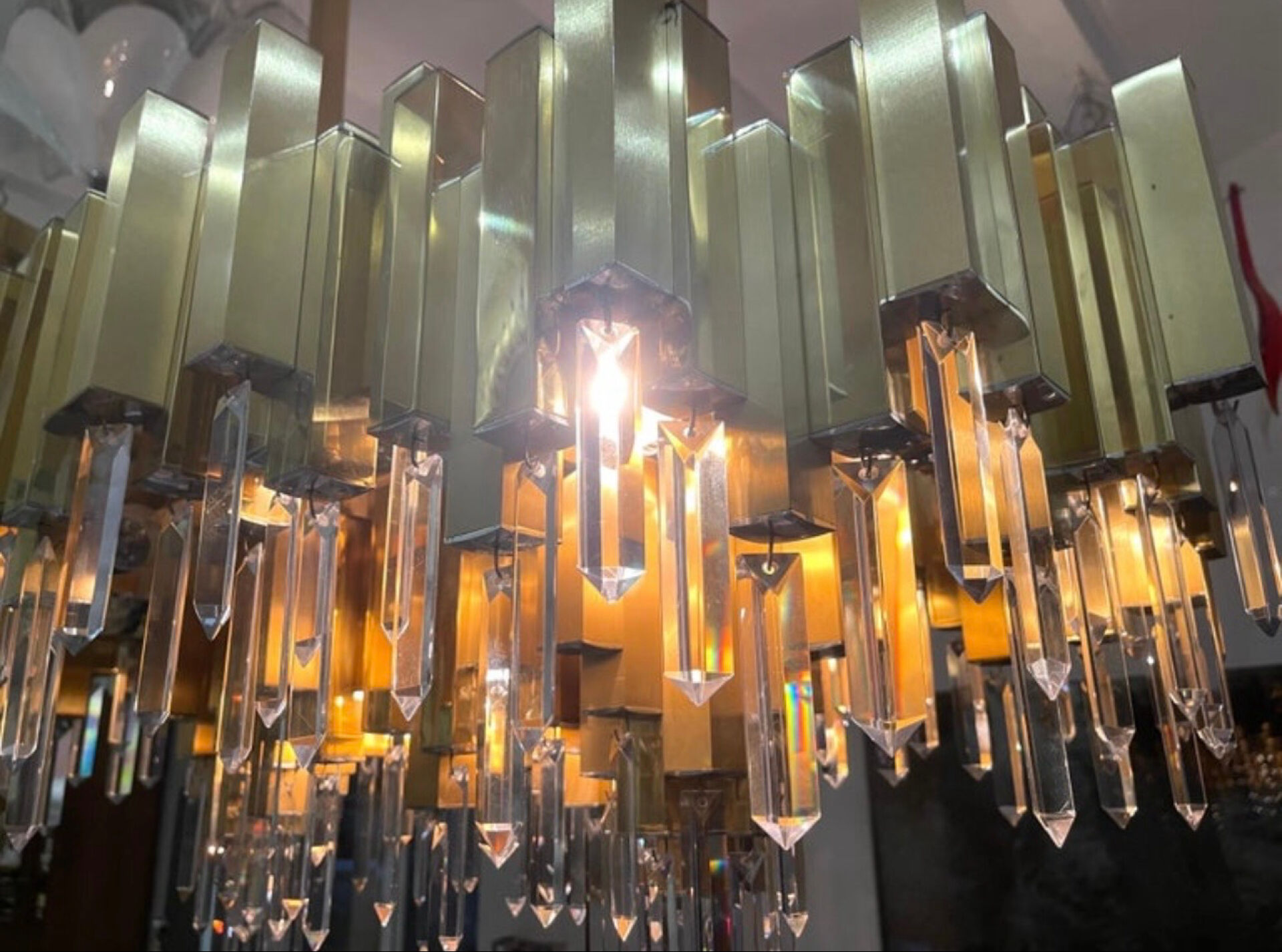 Rare 1970s Lumica chandelier in brass and crystal.