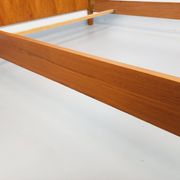 Double bed vintage modernist in teak and black metal from the 1960s with bedside tables.