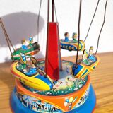Old tin carousel toy