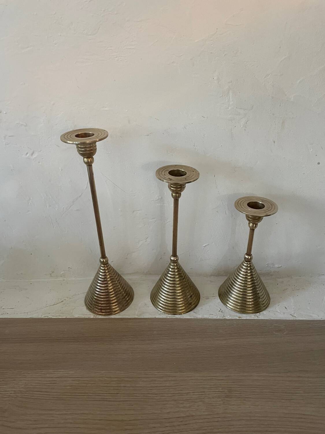 Set of three vintage brass candle holders