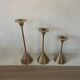 Set of three vintage brass candle holders