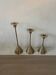 Set of three vintage brass candle holders