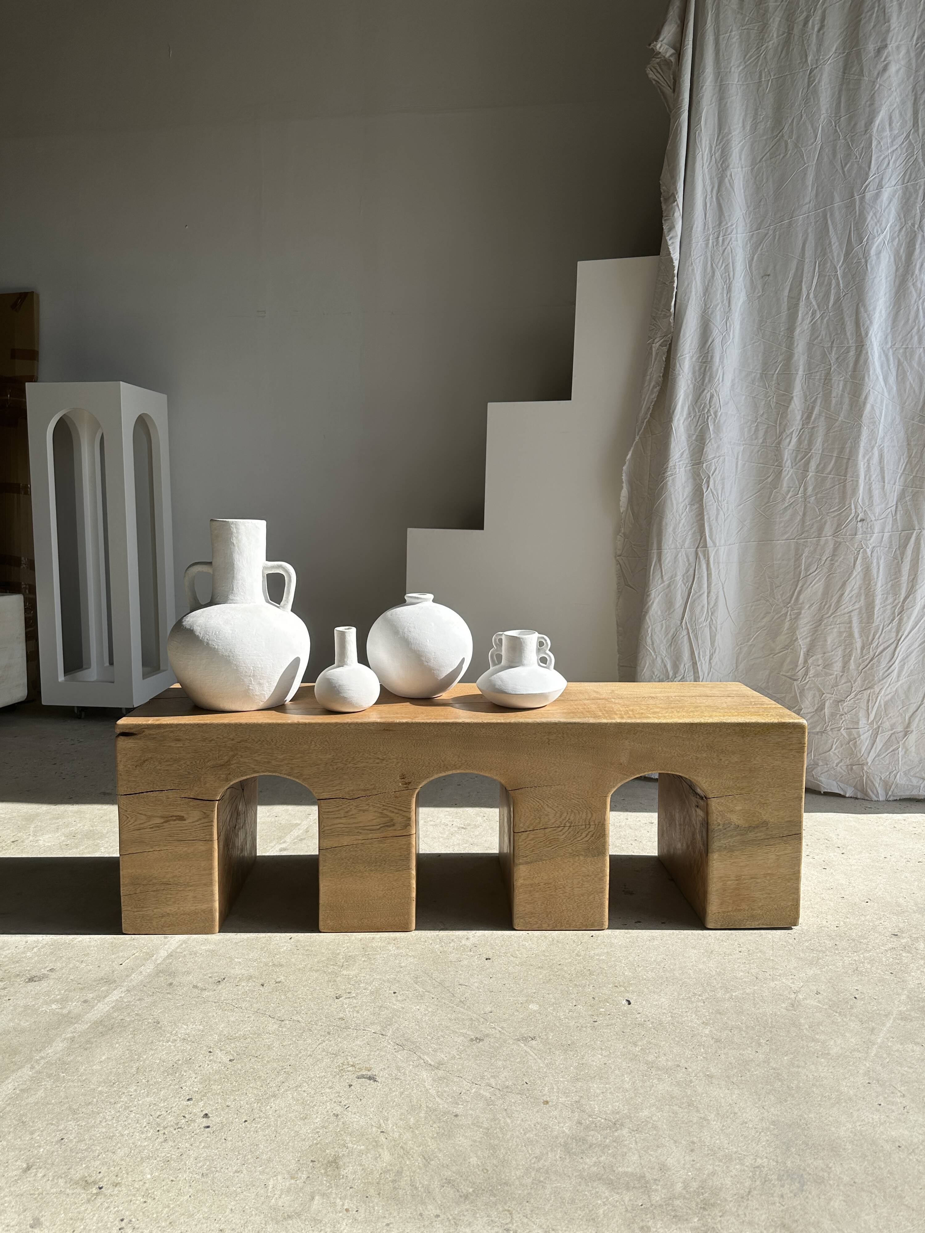 Solid monoxyl wood bench with carved 3-arch base - Natural wood color