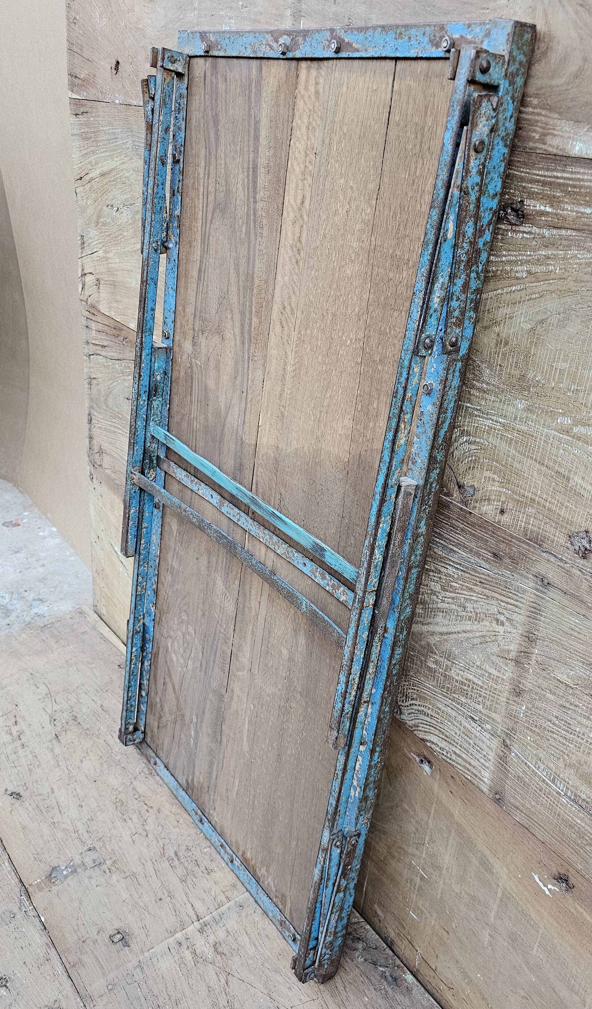 Old folding table in Burmese teak and steel