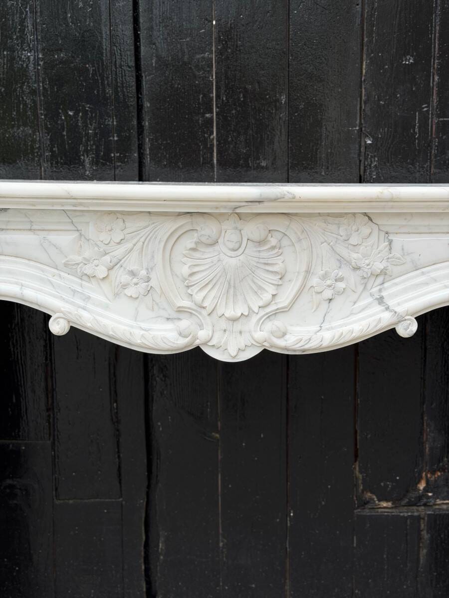 Louis XV style fireplace in Carrara marble, circa 1980.