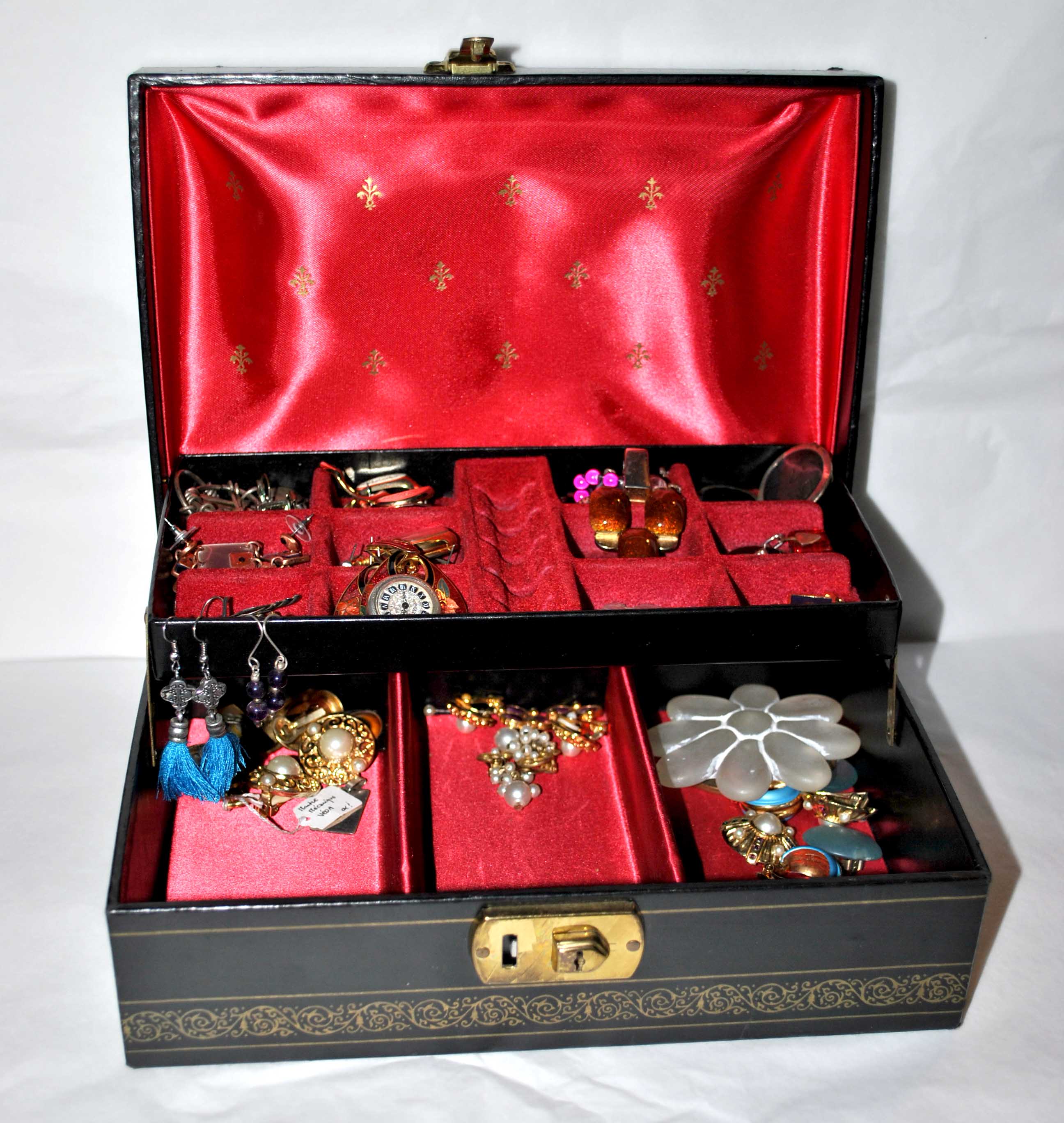 Vintage jewelry box in black leather and red interior
