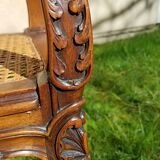 Former seat, wood and caning.