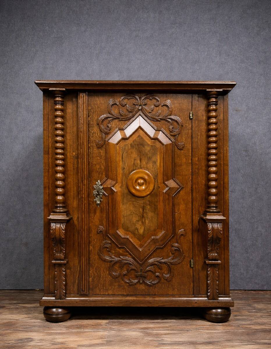 Ornamental piece of solid wood furniture, richly carved, dating from the 17th century.