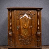 Ornamental piece of solid wood furniture, richly carved, dating from the 17th century.