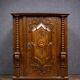 Ornamental piece of solid wood furniture, richly carved, dating from the 17th century.