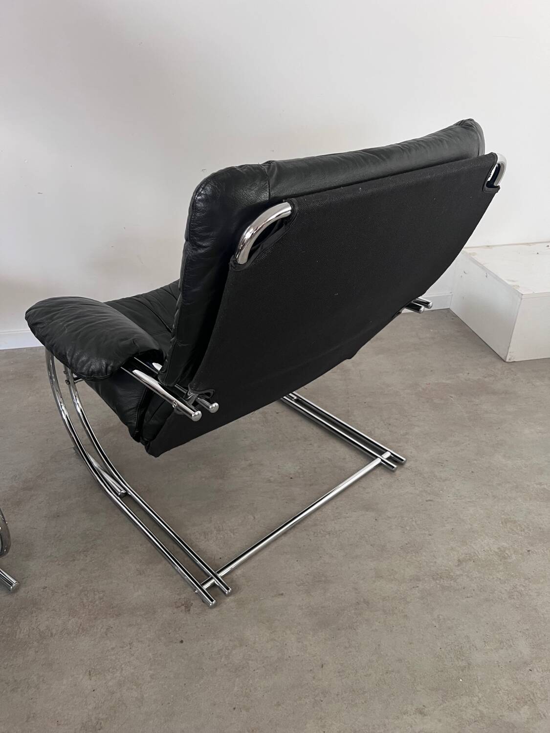 Old armchair and ottoman black leather tubular chrome bauhaus design from the 70s