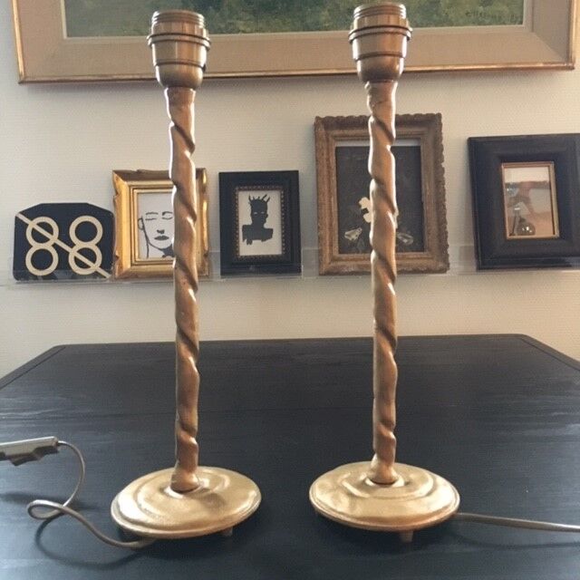 Pair of feet of golden lamps