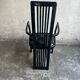 Set of 6 black lacquered wooden dining chairs with high backs and patterned fabric seats, 1980s.