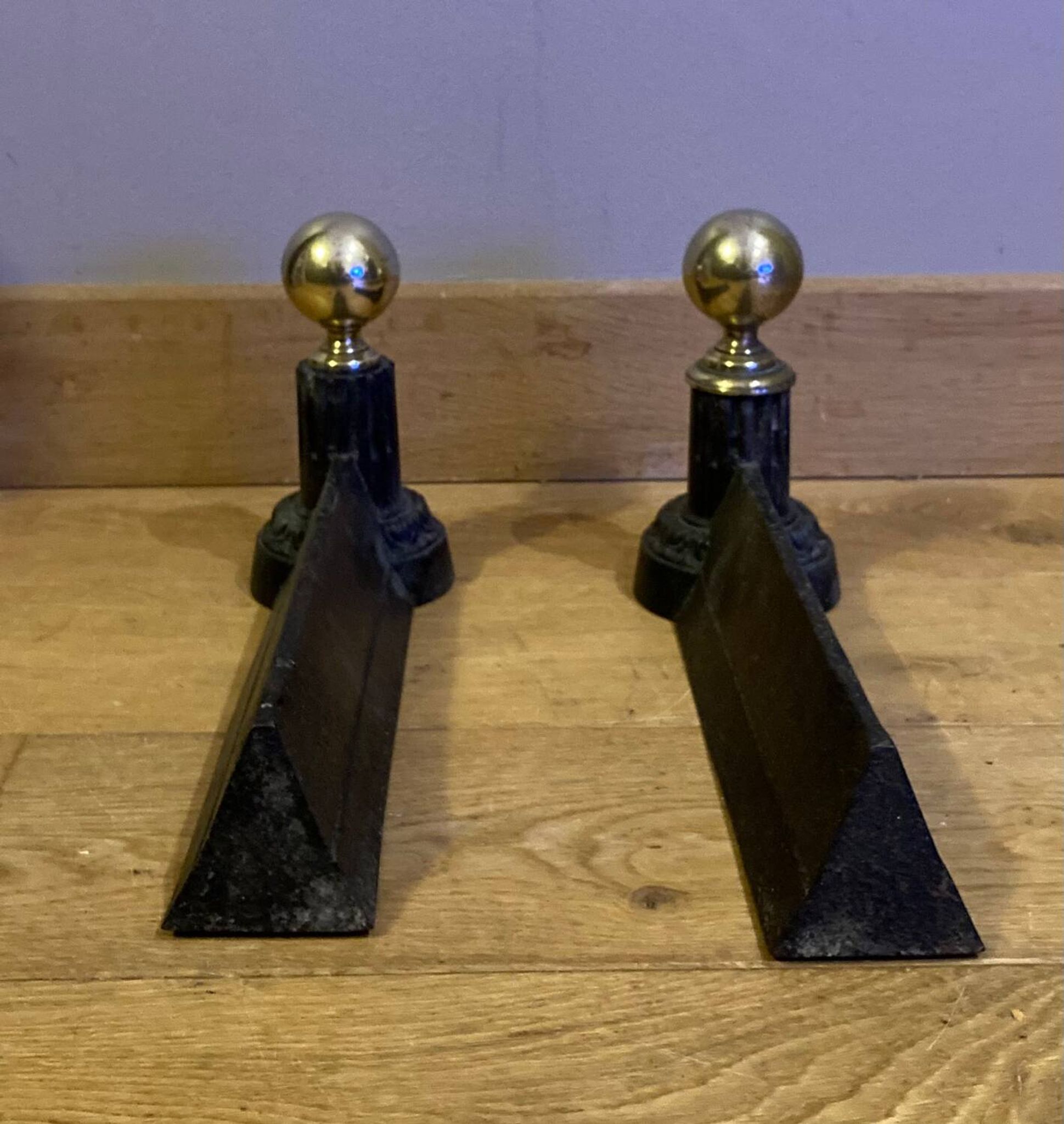 Pair of Napoleon III andirons from the 19th century in cast iron and brass