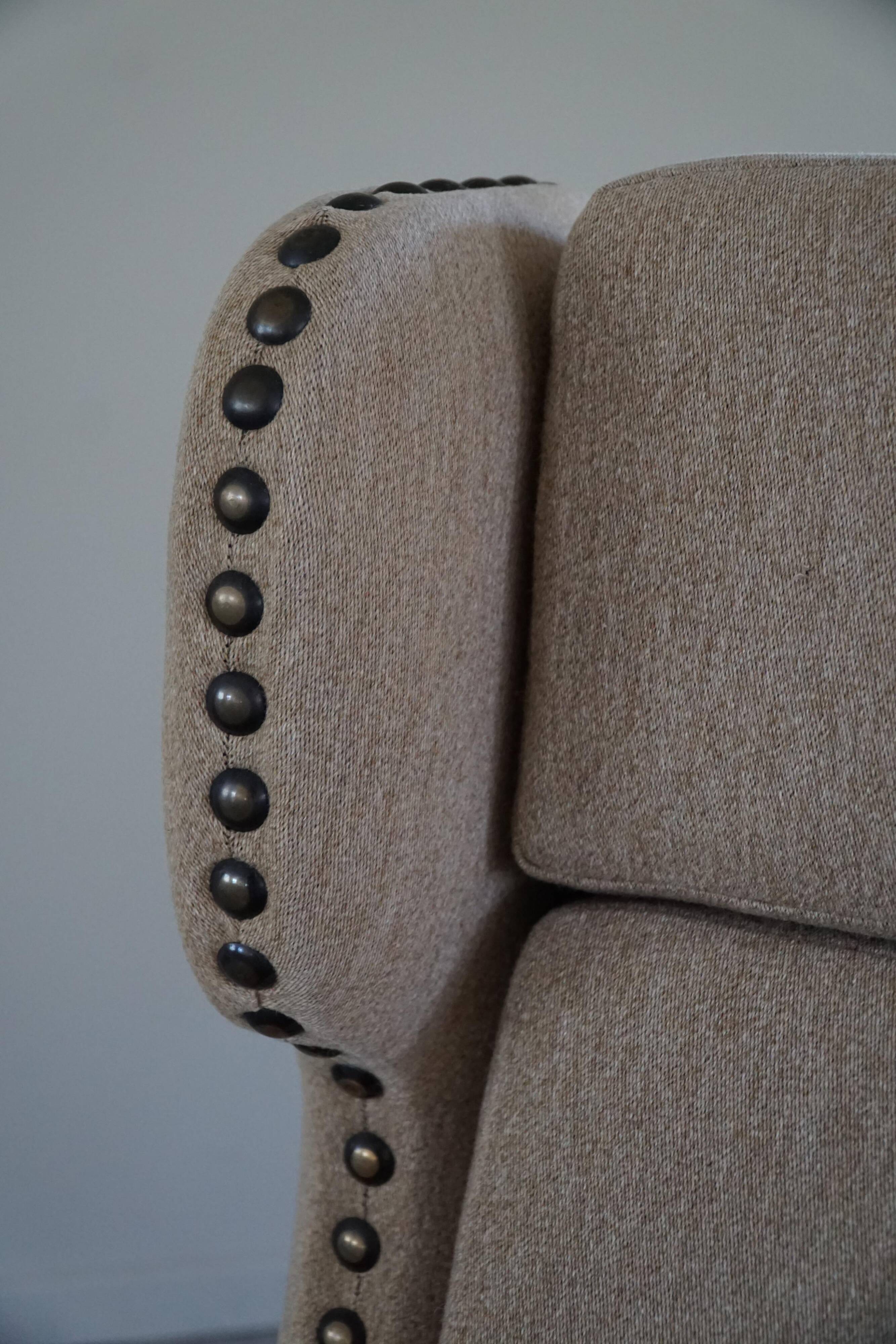 Pair of high-back lounge chairs in modern Danish style in the manner of Henning Kjærnulf, 1960s.