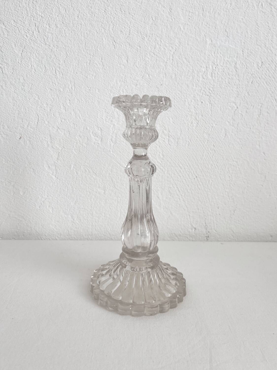 Antique baluster-shaped molded glass candlestick holder