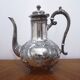 Silver metal teapot in Louis XV style