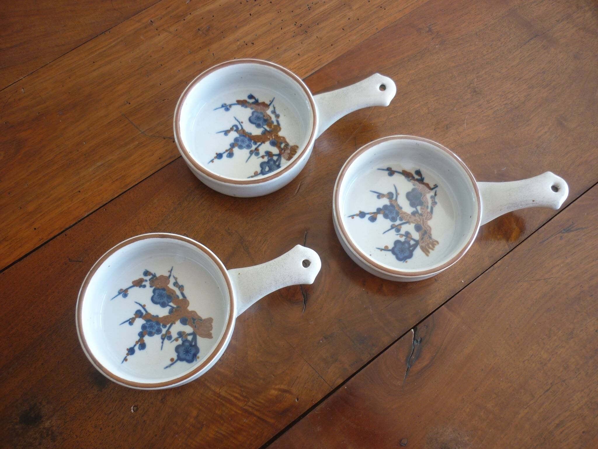 3 ceramic casserole dishes with blue and brown branch pattern