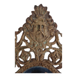 19th century beveled mirror with metal decor