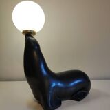 Lampe otarie noire irisée bleue en terre cuite