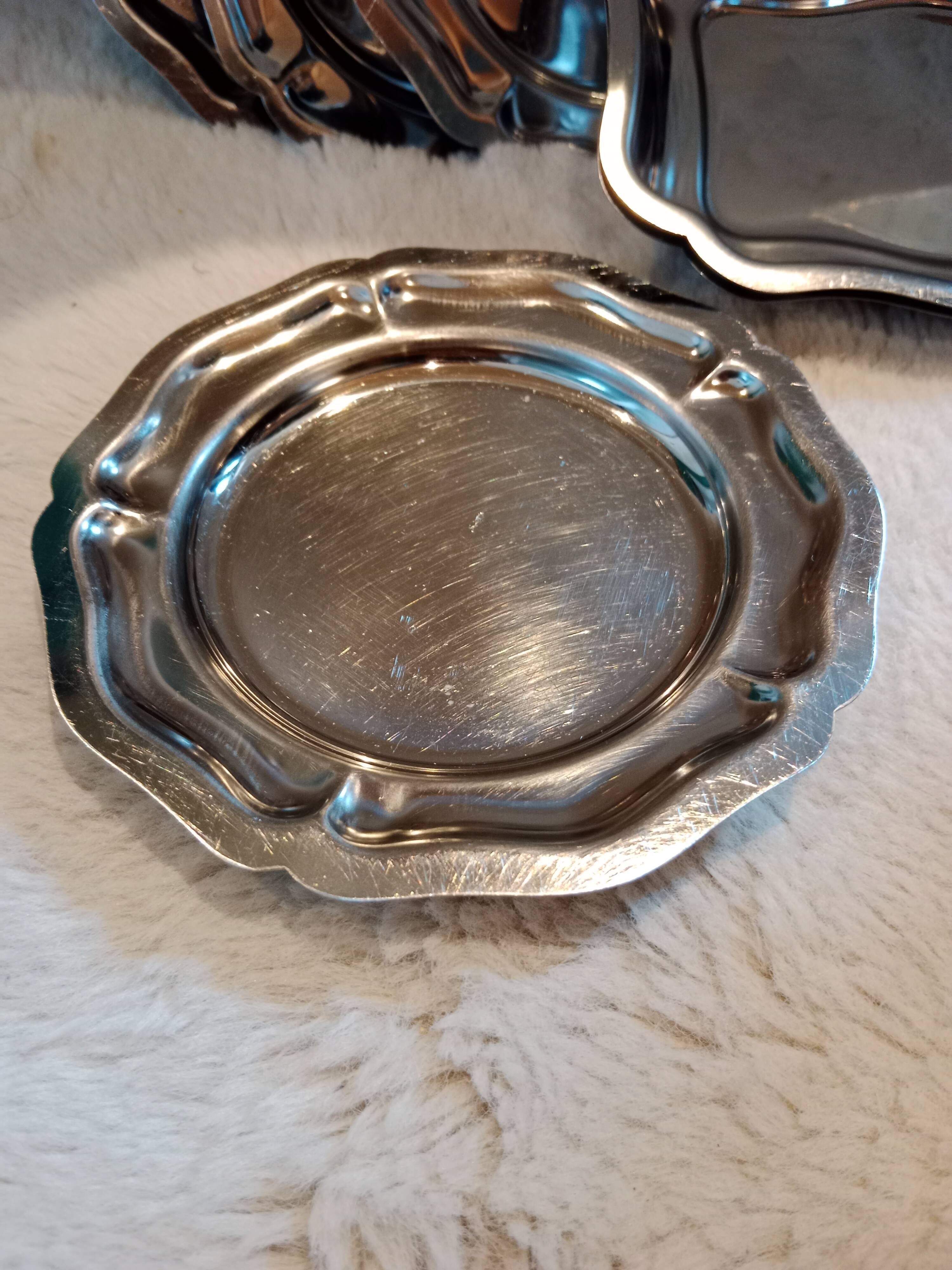 Set of vintage stainless steel mini dishes.
