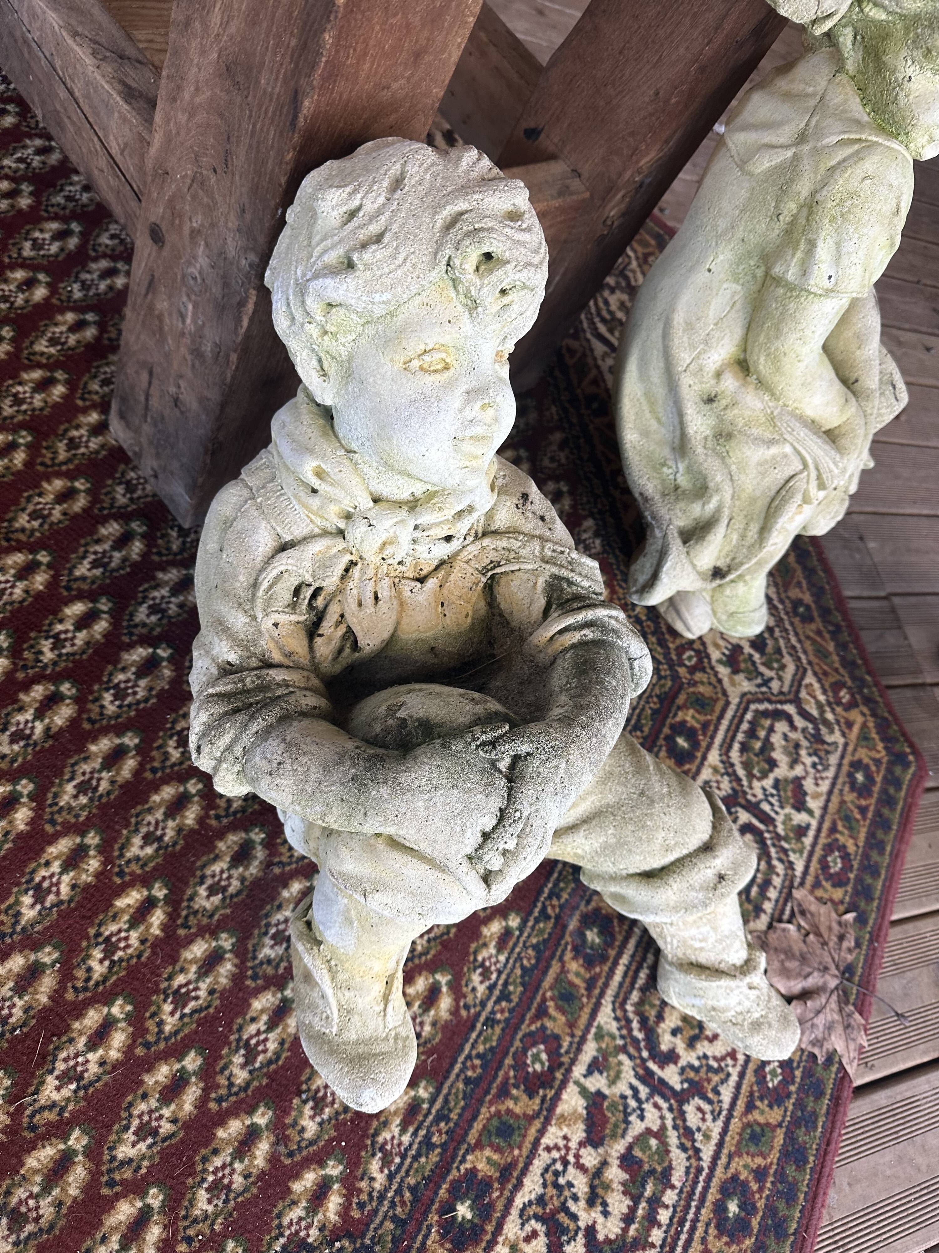 Stone child garden statue