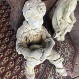 Stone child garden statue