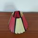 Pleated red and pale yellow plastic conical lampshade from the 1960s.